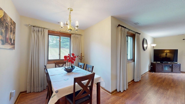 1102 Summer Hill Dr Unit 1102, South Windsor, CT 06074 - dining room featuring a chandelier and wood finished floors