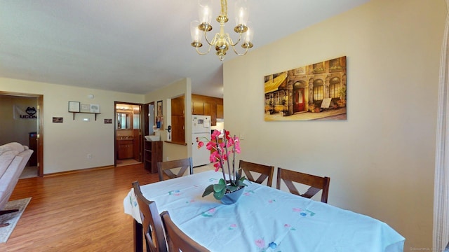 1102 Summer Hill Dr Unit 1102, South Windsor, CT 06074 - dining room with light wood-type flooring and a chandelier