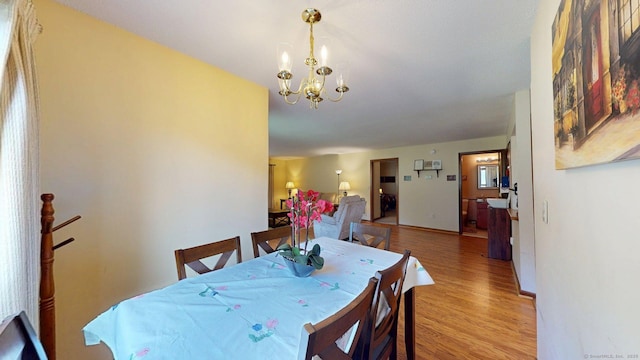 1102 Summer Hill Dr Unit 1102, South Windsor, CT 06074 - dining space with wood finished floors and a chandelier