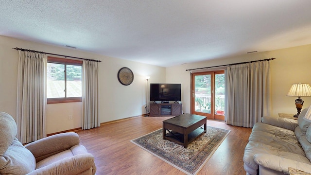 1102 Summer Hill Dr Unit 1102, South Windsor, CT 06074 - living area with healthy amount of natural light and light wood finished floors