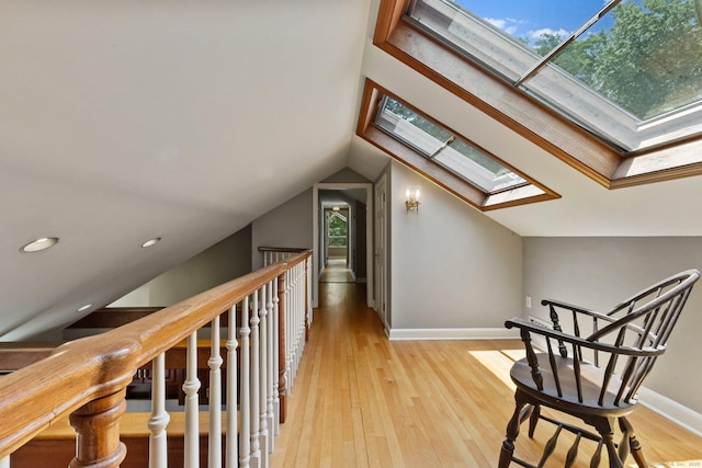 91 Fox Run Rd, New Canaan, CT 06840 - additional living space with a skylight, light wood-type flooring, vaulted ceiling, and recessed lighting