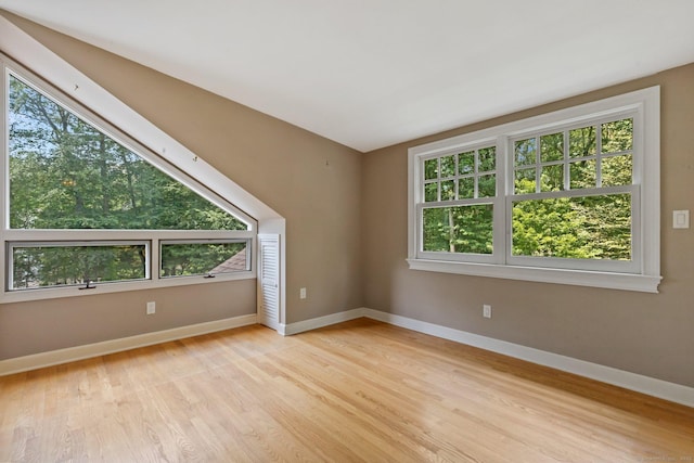 91 Fox Run Rd, New Canaan, CT 06840 - empty room with healthy amount of natural light and light wood-style floors