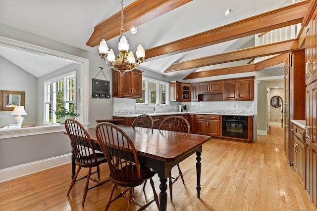 91 Fox Run Rd, New Canaan, CT 06840 - dining area with a chandelier, light wood finished floors, and healthy amount of natural light