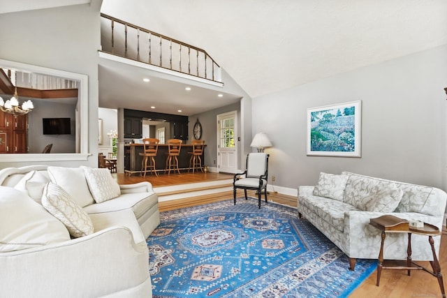 91 Fox Run Rd, New Canaan, CT 06840 - living area with wood finished floors, high vaulted ceiling, and recessed lighting