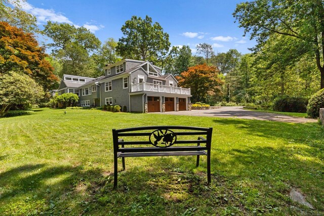91 Fox Run Rd, New Canaan, CT 06840 - view of grassy yard featuring driveway and a garage