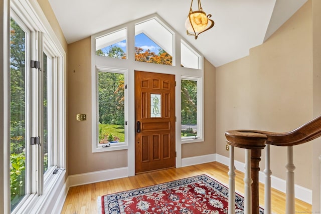 91 Fox Run Rd, New Canaan, CT 06840 - foyer entrance with vaulted ceiling and light wood finished floors