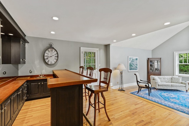 91 Fox Run Rd, New Canaan, CT 06840 - kitchen featuring light wood-style flooring, a kitchen breakfast bar, recessed lighting, wood counters, and open floor plan