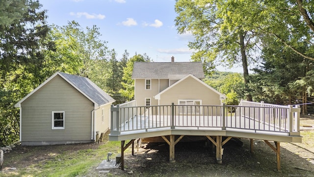 29 Gilyard St, Seymour, CT 06483 - rear view of property featuring a deck, roof with shingles, and view of wooded area