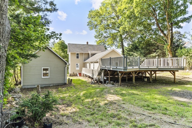 29 Gilyard St, Seymour, CT 06483 - back of house featuring a wooden deck and a lawn