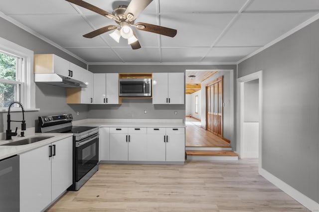 29 Gilyard St, Seymour, CT 06483 - kitchen with stainless steel appliances, light countertops, white cabinetry, ceiling fan, and under cabinet range hood