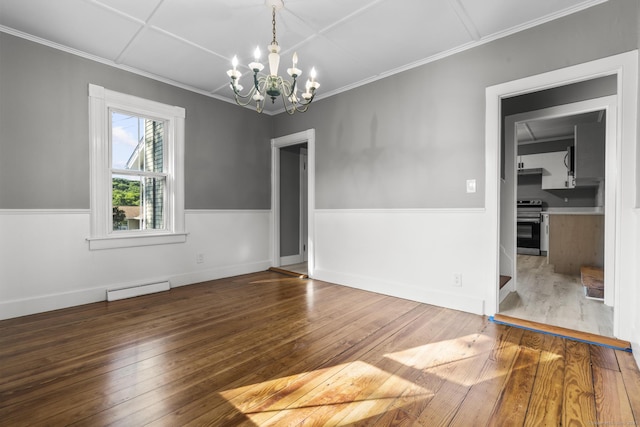 29 Gilyard St, Seymour, CT 06483 - unfurnished room with a baseboard heating unit, a chandelier, hardwood / wood-style flooring, and crown molding