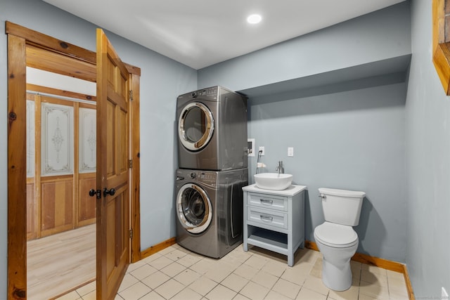 29 Gilyard St, Seymour, CT 06483 - bathroom with stacked washing machine and dryer and vanity