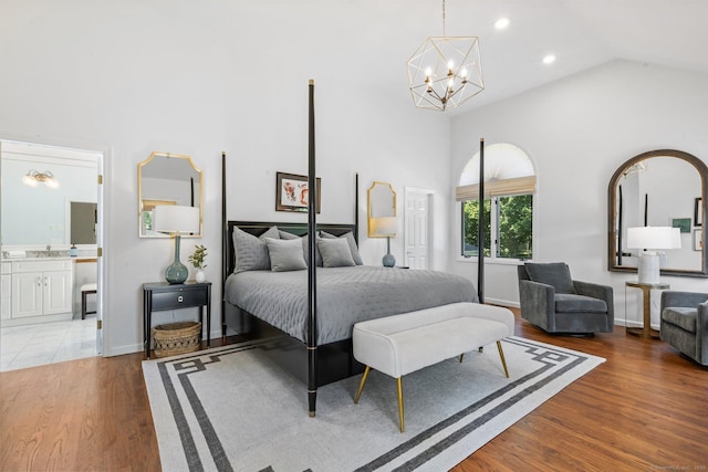 601 Old Stamford Rd, New Canaan, CT 06840 - bedroom with high vaulted ceiling, a chandelier, wood finished floors, recessed lighting, and ensuite bathroom