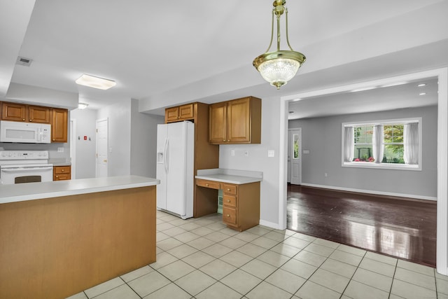 46 Pleasant Ave, Berlin, CT 06037 - kitchen with white appliances, light countertops, light tile patterned flooring, pendant lighting, and brown cabinets