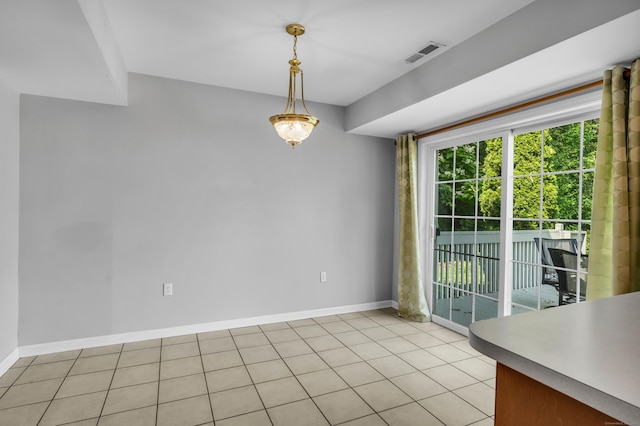 46 Pleasant Ave, Berlin, CT 06037 - unfurnished dining area with baseboards and light tile patterned floors