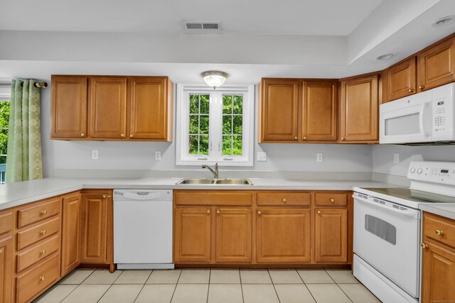 46 Pleasant Ave, Berlin, CT 06037 - kitchen featuring white appliances, light countertops, and brown cabinetry