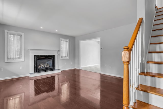 46 Pleasant Ave, Berlin, CT 06037 - unfurnished living room with stairway, recessed lighting, a high end fireplace, and wood finished floors