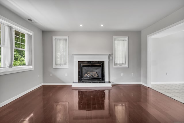 46 Pleasant Ave, Berlin, CT 06037 - unfurnished living room with a premium fireplace, recessed lighting, and wood finished floors