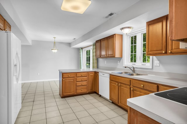46 Pleasant Ave, Berlin, CT 06037 - kitchen featuring white appliances, a peninsula, light countertops, and plenty of natural light