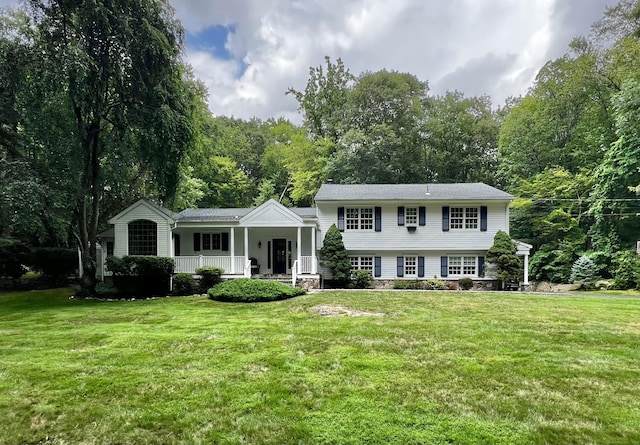 262 Linden Tree Rd, Wilton, CT 06897 - tri-level home featuring covered porch and a front yard