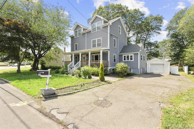 170 Red Oak Rd, Bridgeport, CT 06606 - view of front facade featuring a porch, an outdoor structure, a detached garage, a front yard, and asphalt driveway
