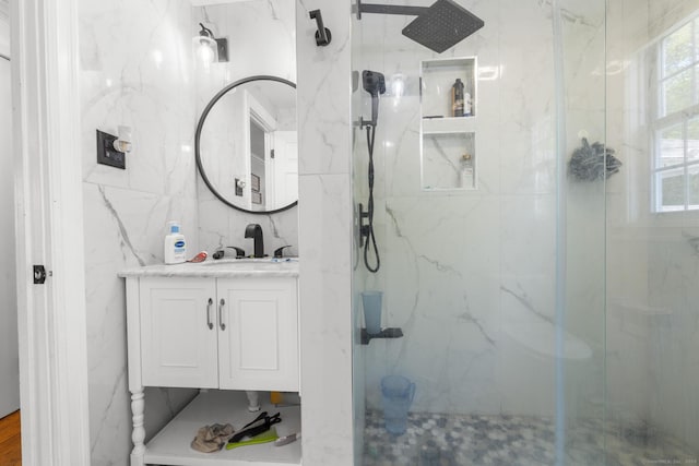 170 Red Oak Rd, Bridgeport, CT 06606 - bathroom featuring a marble finish shower, vanity, and tile walls