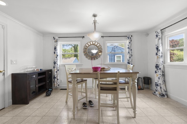 170 Red Oak Rd, Bridgeport, CT 06606 - dining space featuring healthy amount of natural light, light tile patterned floors, and ornamental molding