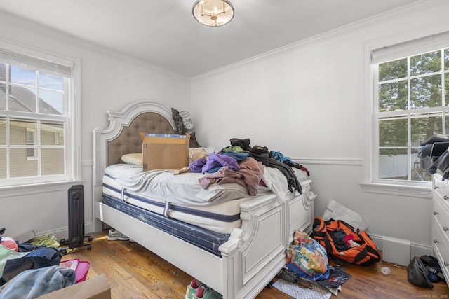170 Red Oak Rd, Bridgeport, CT 06606 - bedroom featuring wood finished floors, multiple windows, and ornamental molding