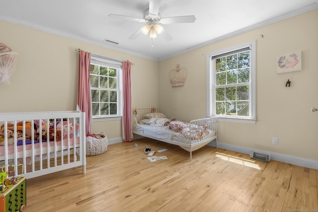 170 Red Oak Rd, Bridgeport, CT 06606 - bedroom with crown molding, wood finished floors, and a ceiling fan