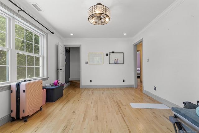 170 Red Oak Rd, Bridgeport, CT 06606 - interior space featuring light wood-type flooring, crown molding, radiator heating unit, a chandelier, and recessed lighting