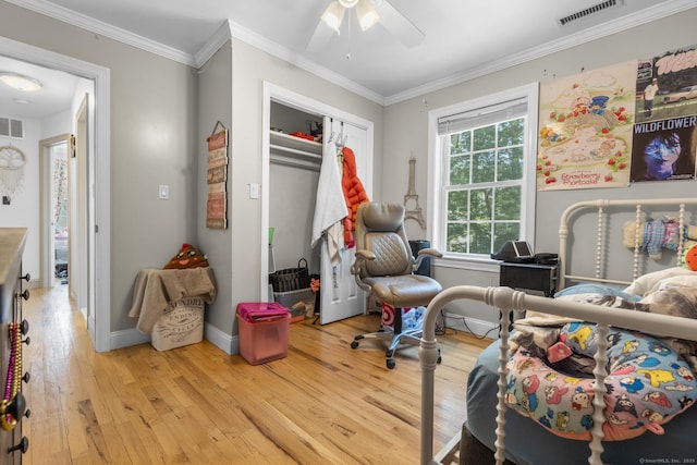 170 Red Oak Rd, Bridgeport, CT 06606 - bedroom with wood finished floors, a closet, ornamental molding, and ceiling fan