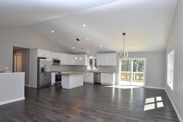 152 Buff Cap Rd, Tolland, CT 06084 - kitchen with appliances with stainless steel finishes, open floor plan, backsplash, a center island, and white cabinets