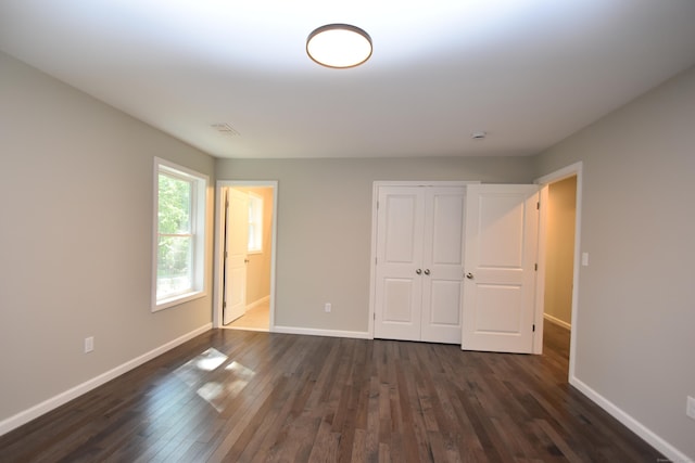 152 Buff Cap Rd, Tolland, CT 06084 - unfurnished bedroom featuring dark wood-style flooring, a closet, and ensuite bath
