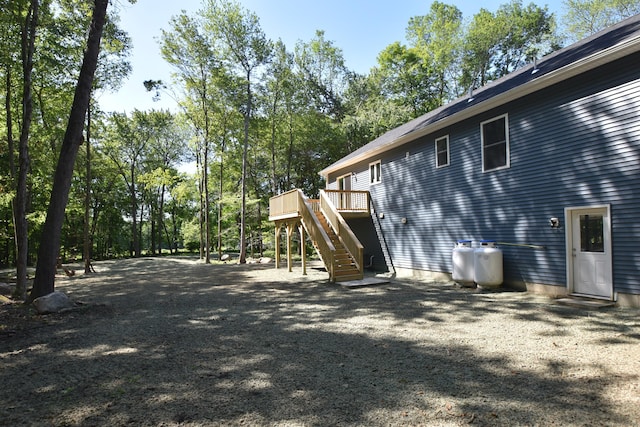 152 Buff Cap Rd, Tolland, CT 06084 - view of home's exterior with stairway and a wooden deck