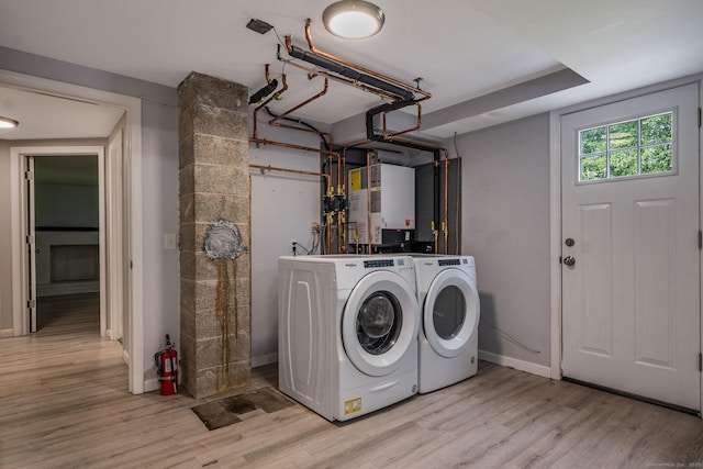 15 Rosemary Ln, Guilford, CT 06437 - laundry room with washing machine and dryer, wood finished floors, and heating unit