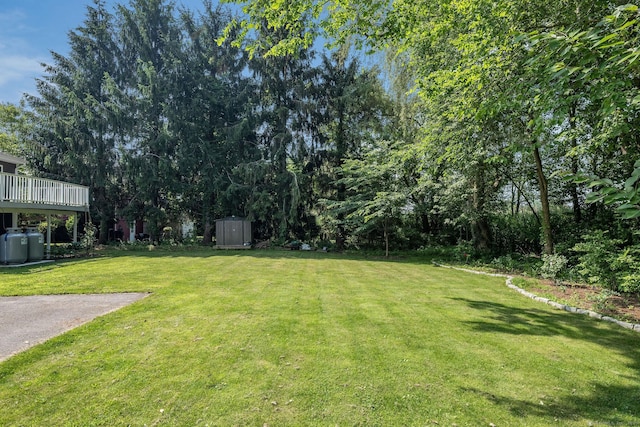 15 Rosemary Ln, Guilford, CT 06437 - view of green lawn featuring a storage shed
