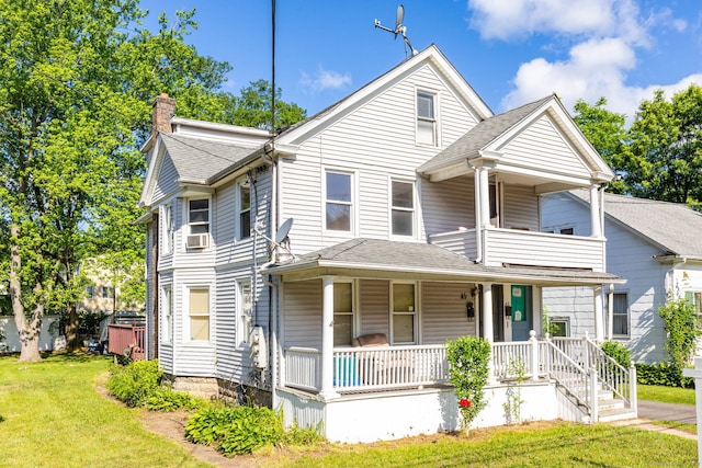 45 William St, East Hartford, CT 06108 - view of front of house featuring a porch, a chimney, a front lawn, a balcony, and a shingled roof