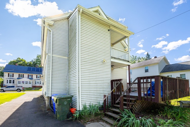 45 William St, East Hartford, CT 06108 - rear view of house featuring a wooden deck and a balcony