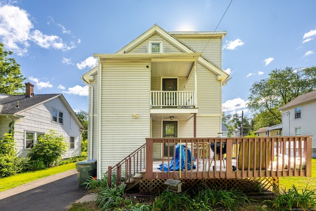 45 William St, East Hartford, CT 06108 - back of property with a balcony and a wooden deck