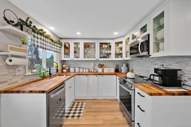 13 Baldwin Hill Rd, Litchfield, CT 06759 - kitchen with butcher block counters, appliances with stainless steel finishes, open shelves, decorative backsplash, and white cabinetry