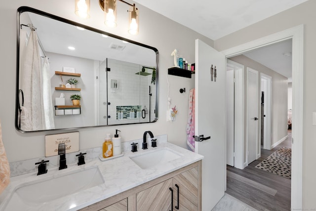 13 Baldwin Hill Rd, Litchfield, CT 06759 - full bathroom with a stall shower, double vanity, and wood finished floors