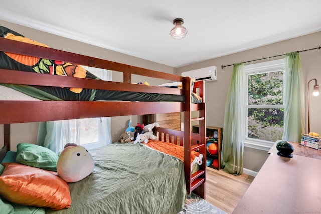 13 Baldwin Hill Rd, Litchfield, CT 06759 - bedroom with a wall unit AC, wood finished floors, and multiple windows
