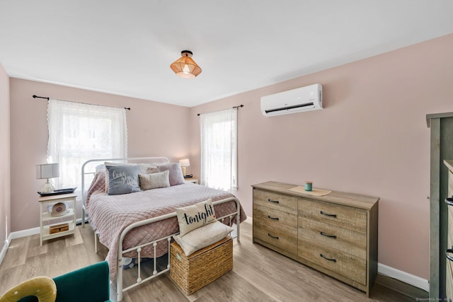 13 Baldwin Hill Rd, Litchfield, CT 06759 - bedroom featuring a wall unit AC and light wood-type flooring