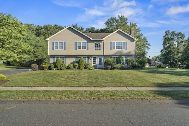 8 Barbara Ln, Southington, CT 06479 - view of front facade featuring a front lawn and a chimney