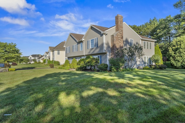 8 Barbara Ln, Southington, CT 06479 - view of side of property with a chimney, a yard, and a residential view