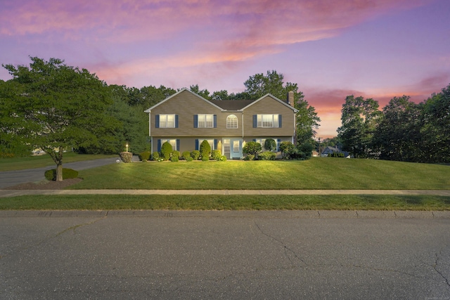 8 Barbara Ln, Southington, CT 06479 - view of front facade with a front yard, a chimney, and driveway
