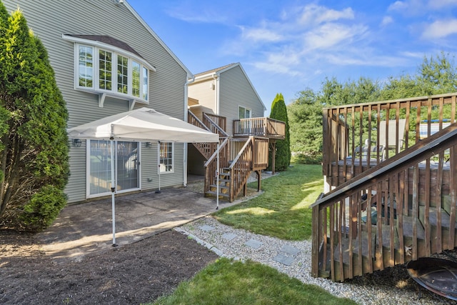 8 Barbara Ln, Southington, CT 06479 - view of grassy yard featuring stairs, a patio area, and a deck