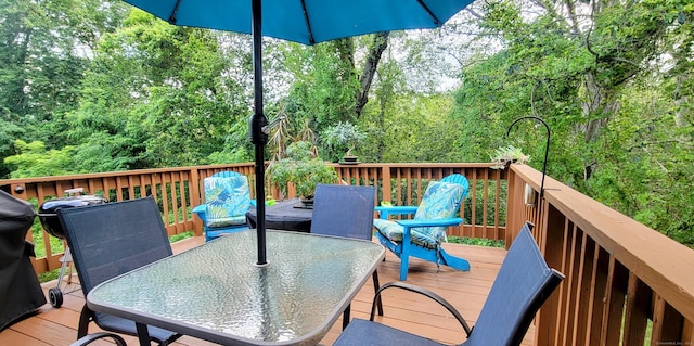 145 Brighton Cir, Windsor, CT 06095 - wooden deck featuring outdoor dining space and a wooded view