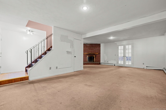 21 Gilbert Hill Rd, Norwalk, CT 06853 - unfurnished living room featuring carpet floors, a baseboard radiator, a brick fireplace, stairs, and recessed lighting