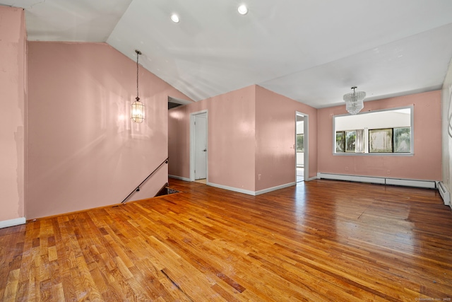 21 Gilbert Hill Rd, Norwalk, CT 06853 - empty room with a chandelier, wood finished floors, a baseboard radiator, vaulted ceiling, and recessed lighting